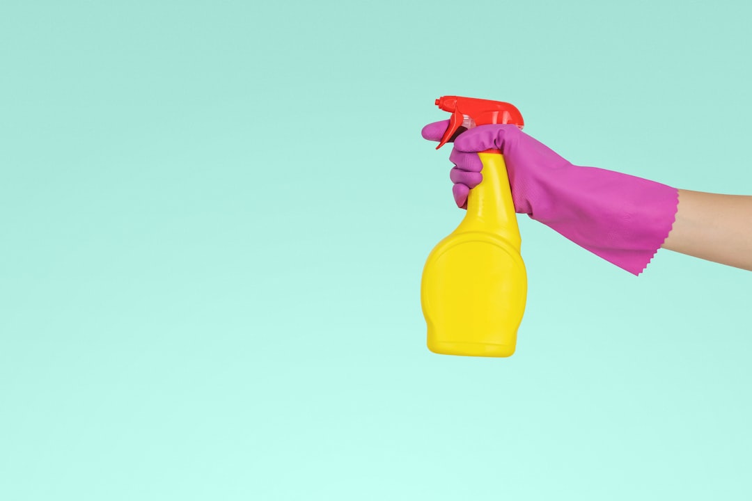 why-choose-us person-holding-yellow-plastic-spray-bottle-zmnefoi3k